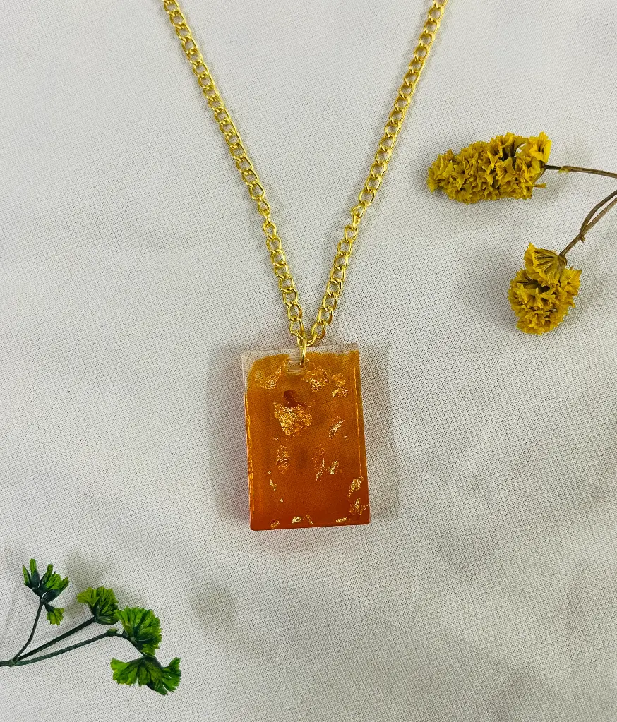 An Orange with gold flakes Locket -GML021