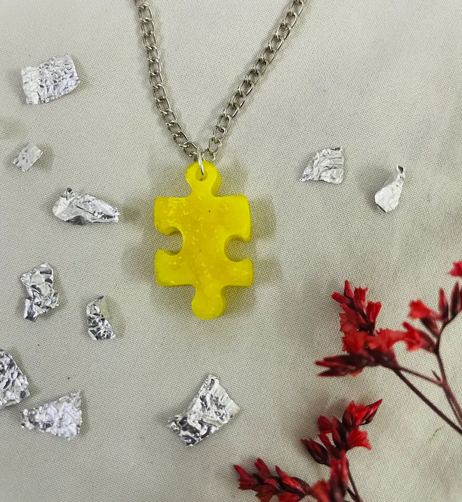 A yellow puzzle Locket -GML032