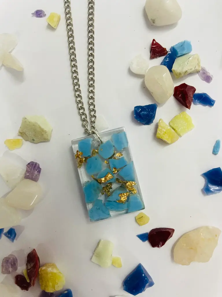 A rectangular Blue ang gold flakes Locket -GML036