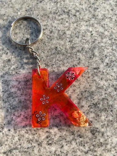 Letter 'K' in red and gold flakes with design Keychain -GMK065